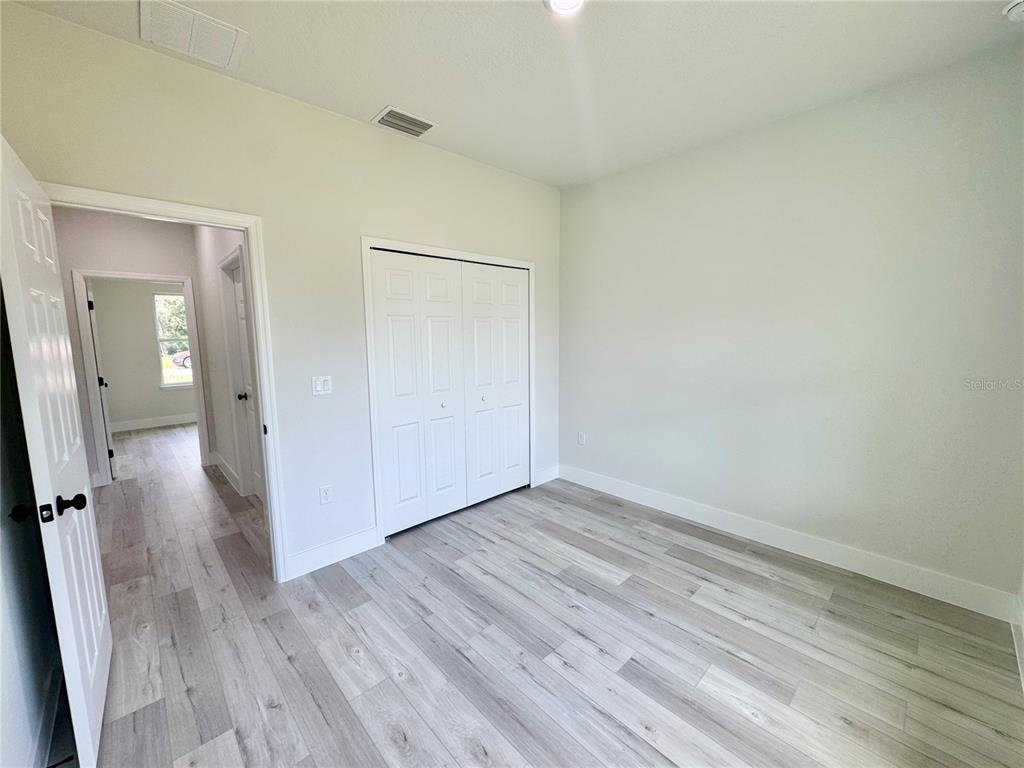 1690 Hamilton Avenue Southwest Palm Bay, FL 32908 - Photo 51 of 56 a view of a room with wooden floor