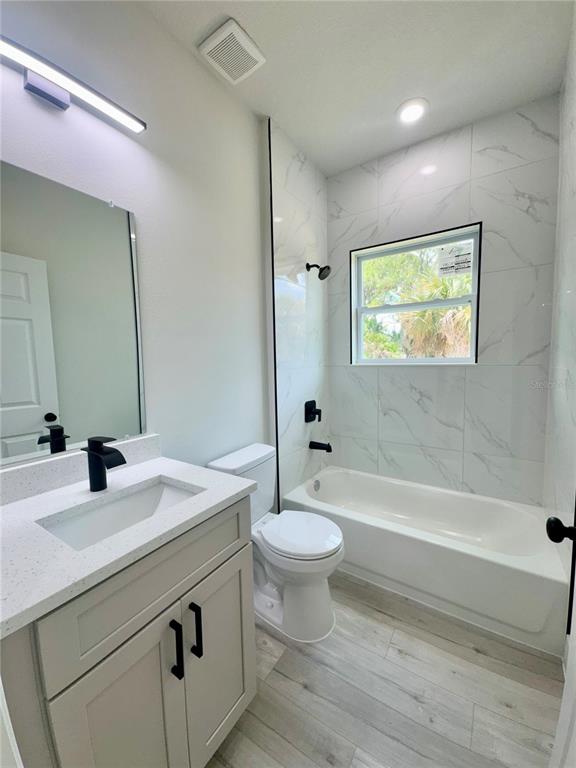 1690 Hamilton Avenue Southwest Palm Bay, FL 32908 - Photo 53 of 56 a bathroom with a sink a toilet and shower