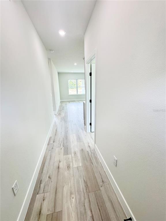 1690 Hamilton Avenue Southwest Palm Bay, FL 32908 - Photo 9 of 56 a view of a room with wooden floor