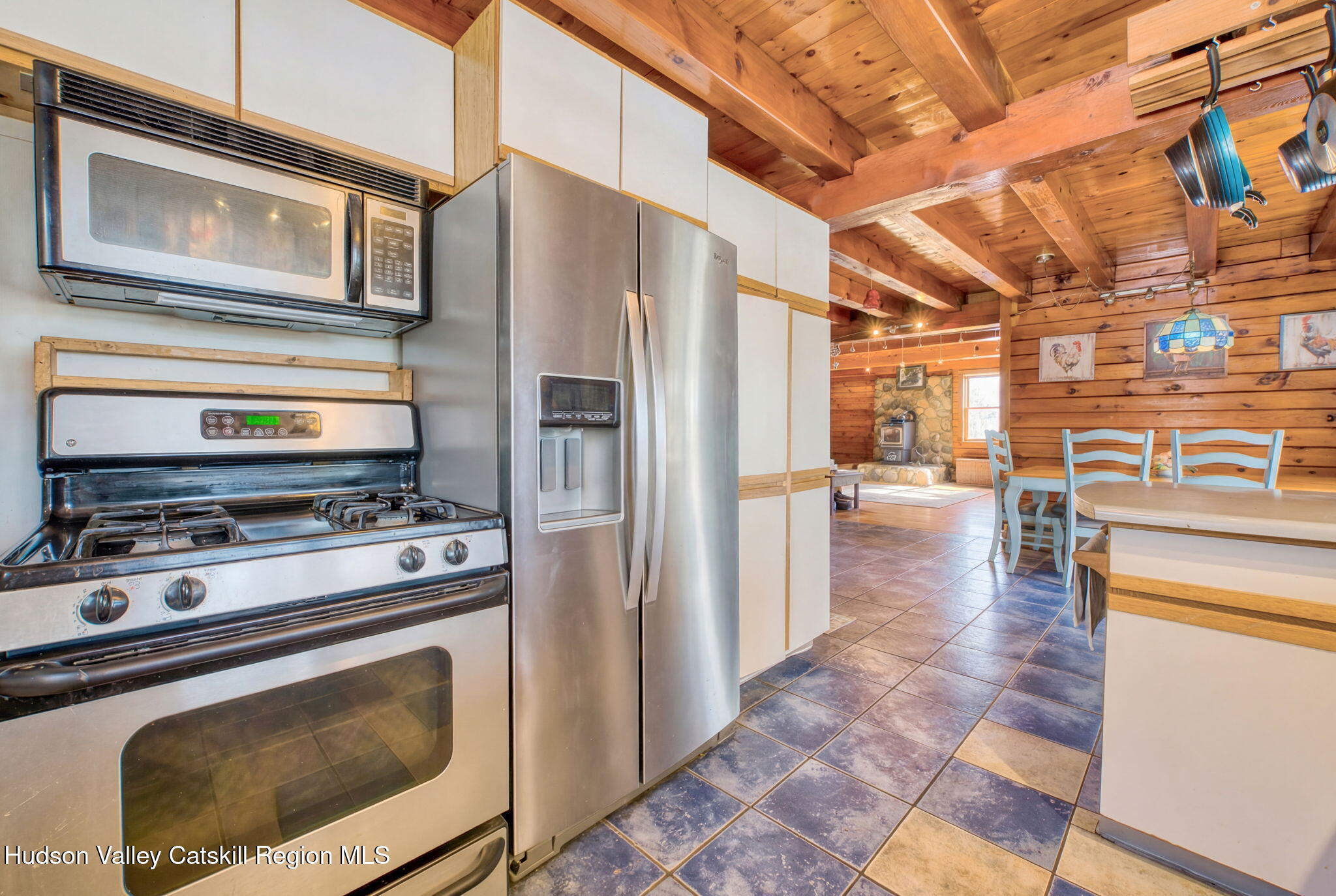 189 Yeagerville Road Napanoch, NY 12458 - Photo 12 of 38 a kitchen with a stove and a microwave
