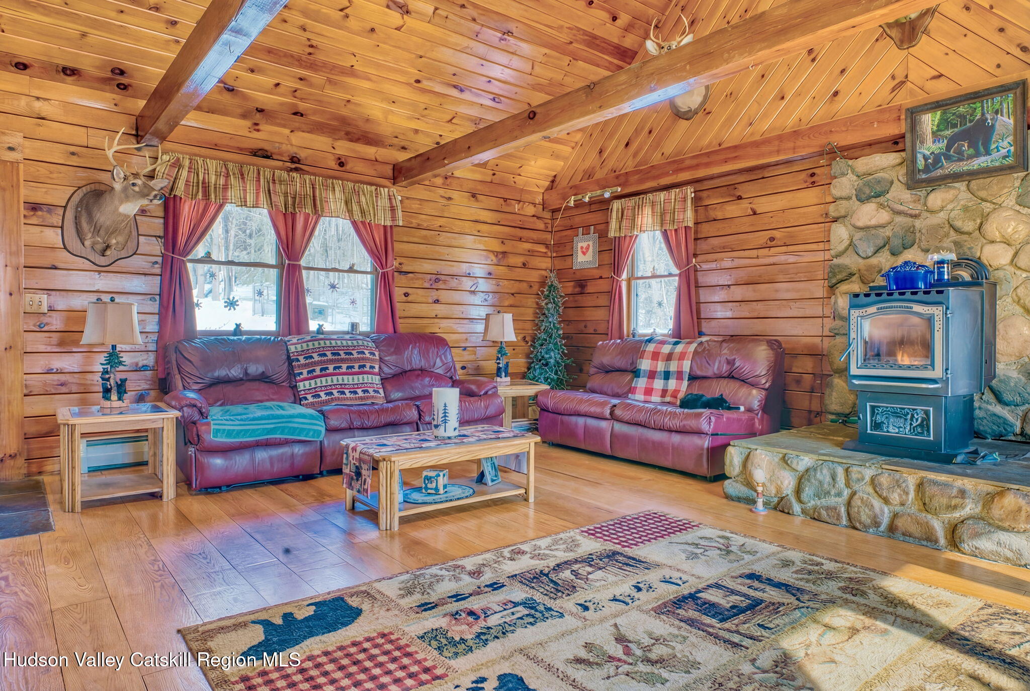 189 Yeagerville Road Napanoch, NY 12458 - Photo 14 of 38 a living room with furniture and a fireplace