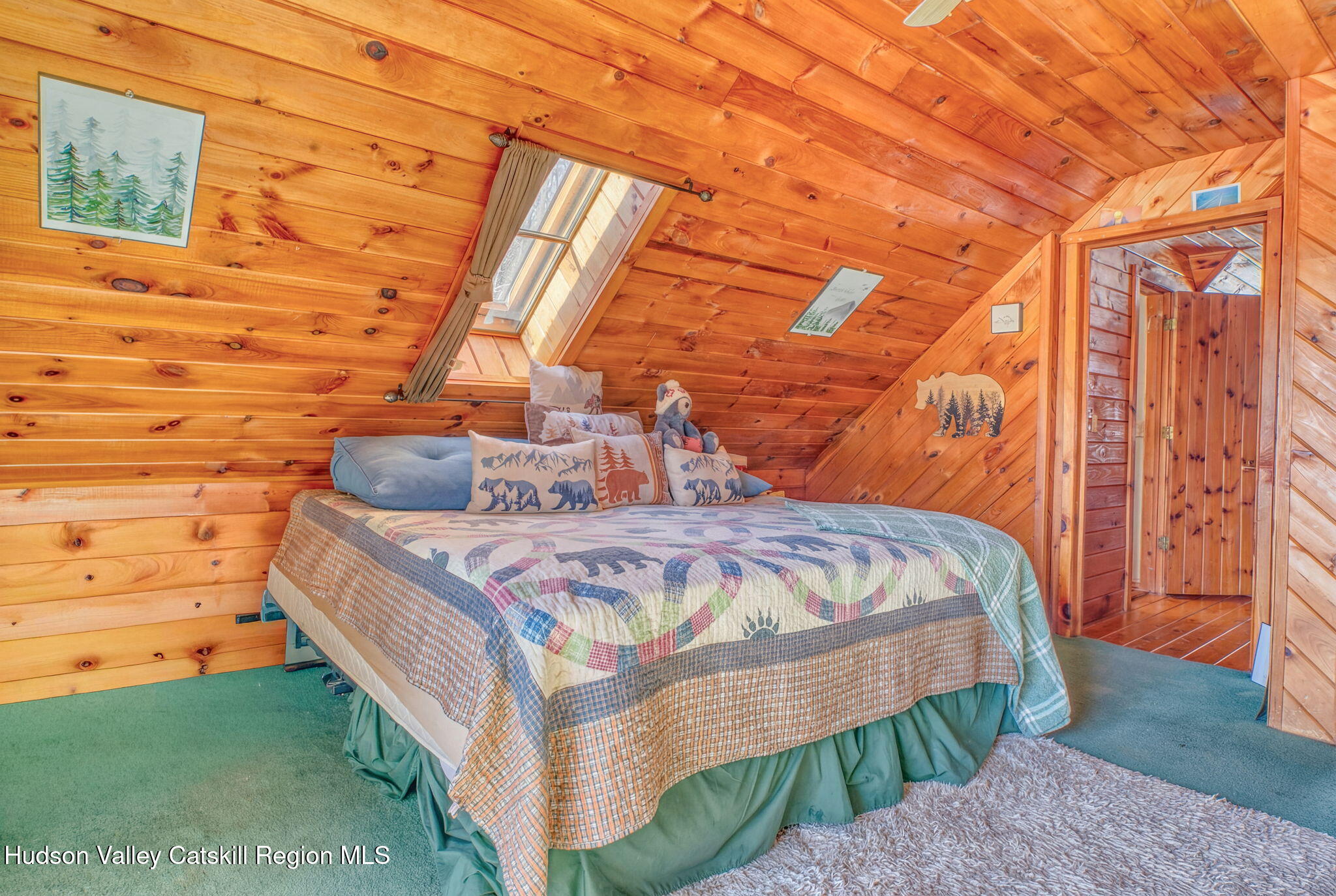 189 Yeagerville Road Napanoch, NY 12458 - Photo 20 of 38 a spacious bedroom with a bed and a window