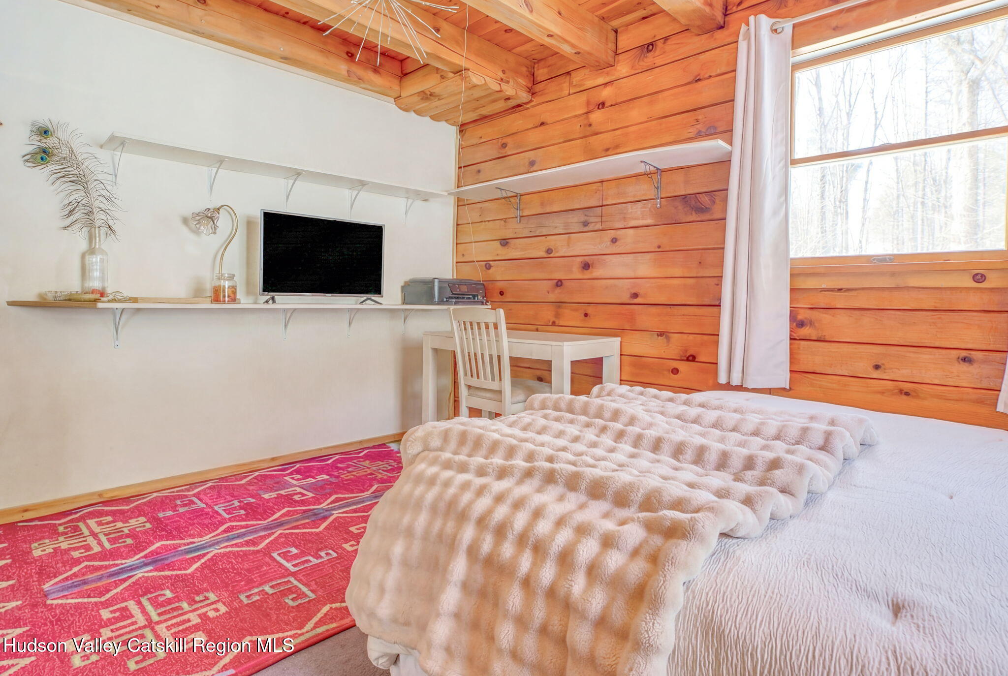 189 Yeagerville Road Napanoch, NY 12458 - Photo 24 of 38 a bedroom with a bed and a flat screen tv