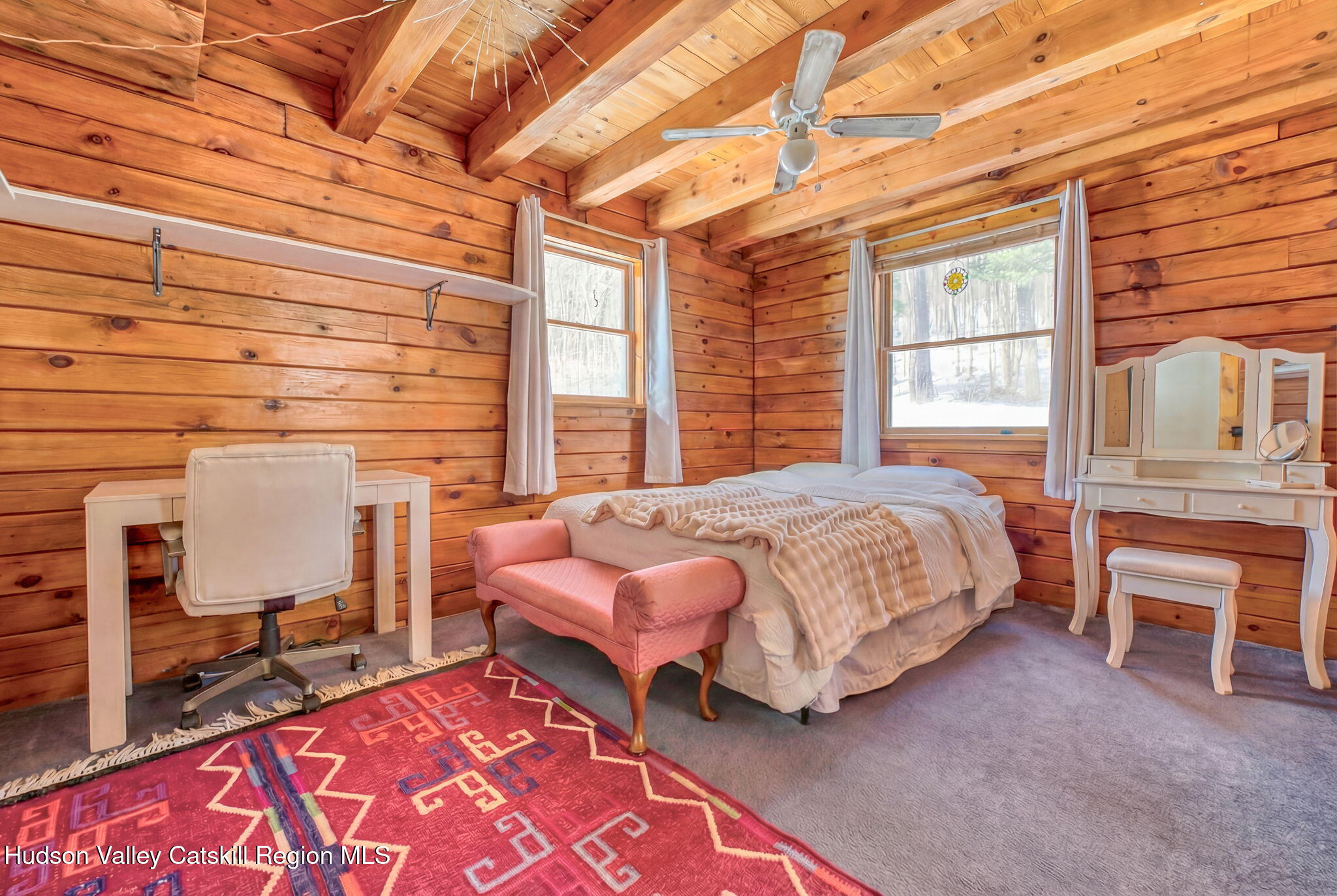 189 Yeagerville Road Napanoch, NY 12458 - Photo 25 of 38 a bedroom with a bed and wooden floor