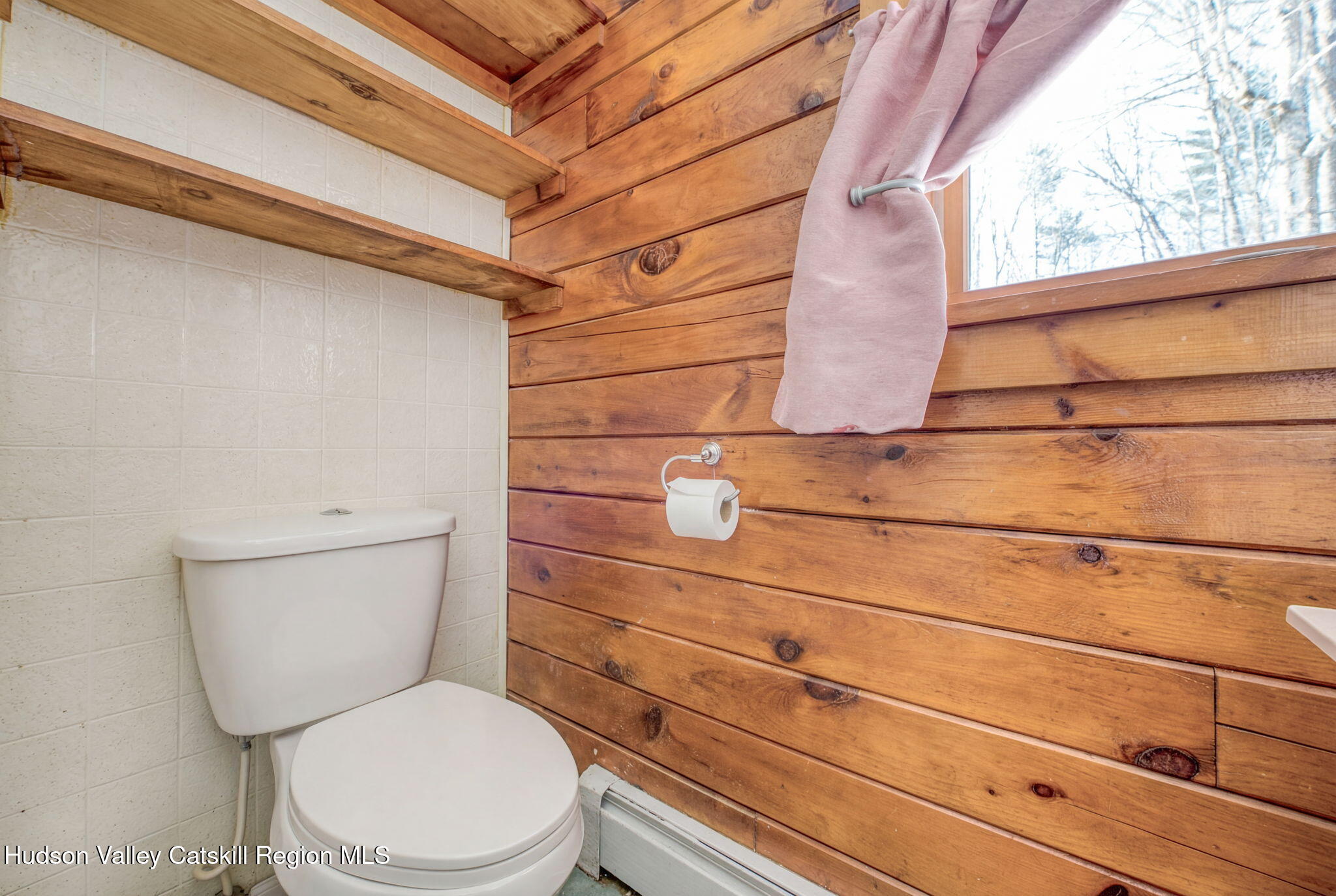 189 Yeagerville Road Napanoch, NY 12458 - Photo 30 of 38 a bathroom with a toilet and a shower curtain