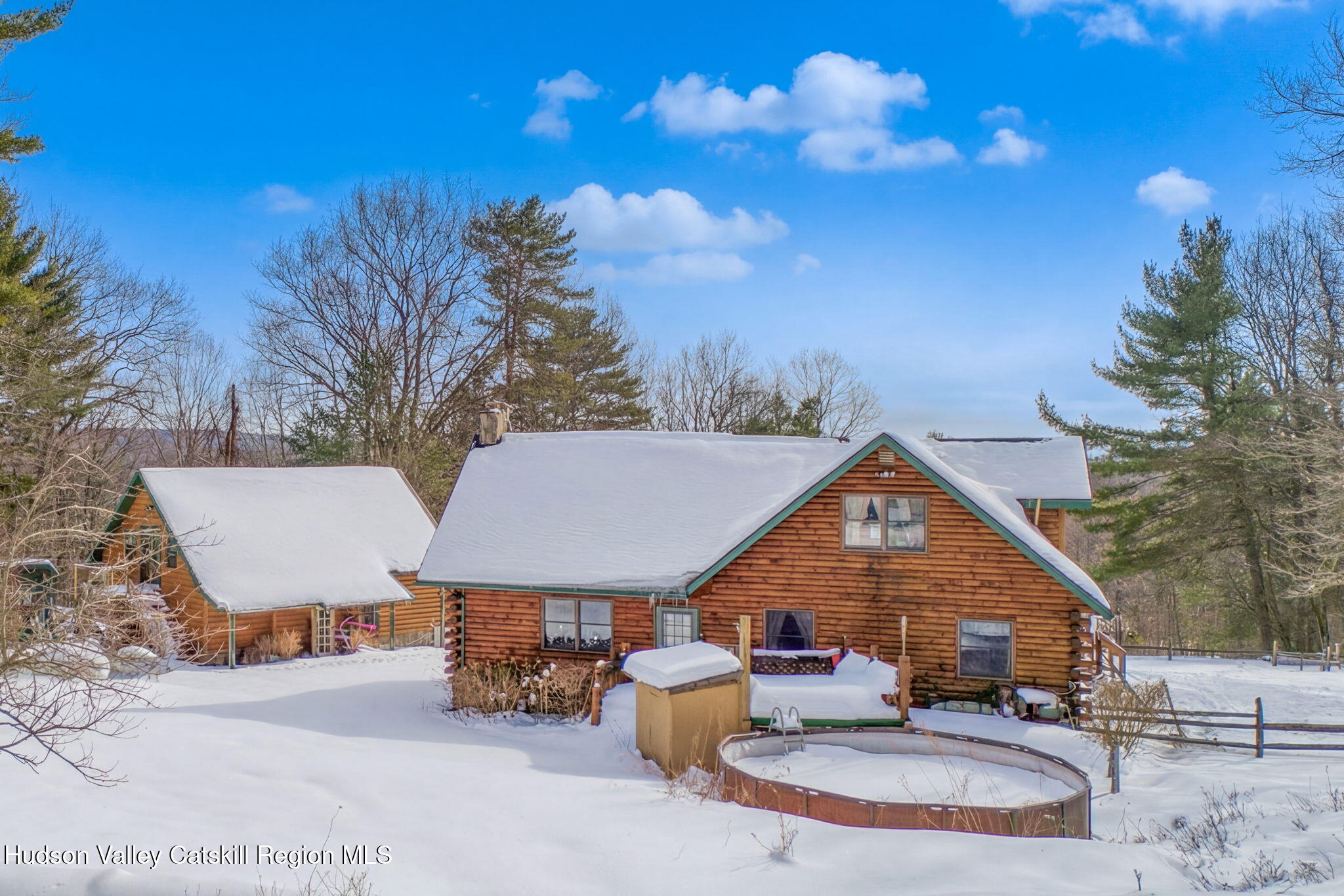 189 Yeagerville Road Napanoch, NY 12458 - Photo 4 of 38 a view of a patio with couches table and chairs with wooden fence and plants