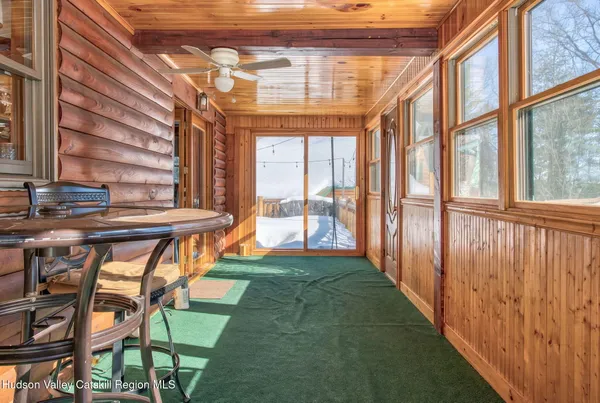a view of an chairs and table in the balcony