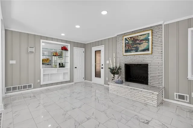 a view of a livingroom with an empty space and fire place