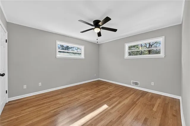 a view of room with wooden floor and window