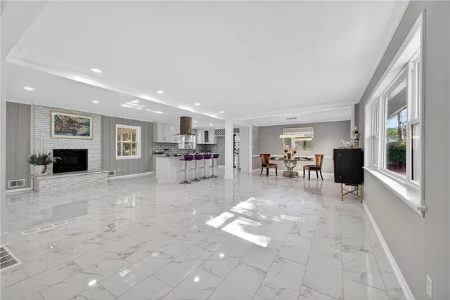 a view of a livingroom with furniture and a flat screen tv