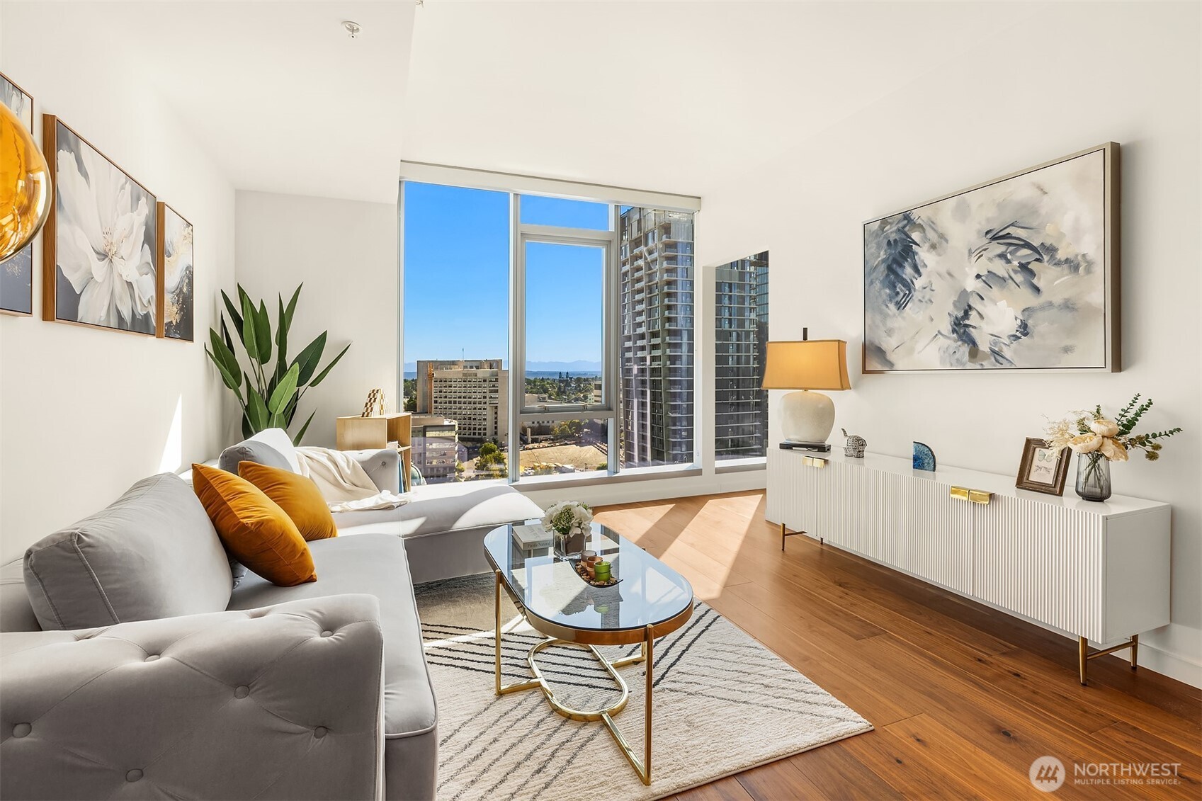 800 Columbia Street, Unit 2307 Seattle, WA 98104 - Photo 3 of 40 a living room with furniture and a large window