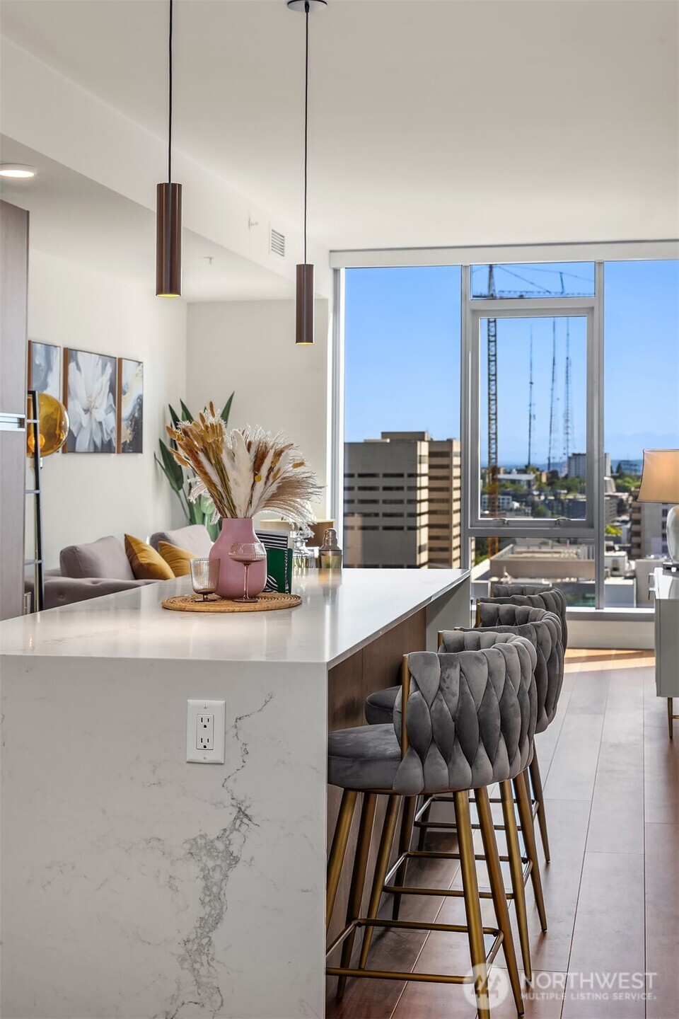 800 Columbia Street, Unit 2307 Seattle, WA 98104 - Photo 6 of 40 a living room with furniture and wooden floor