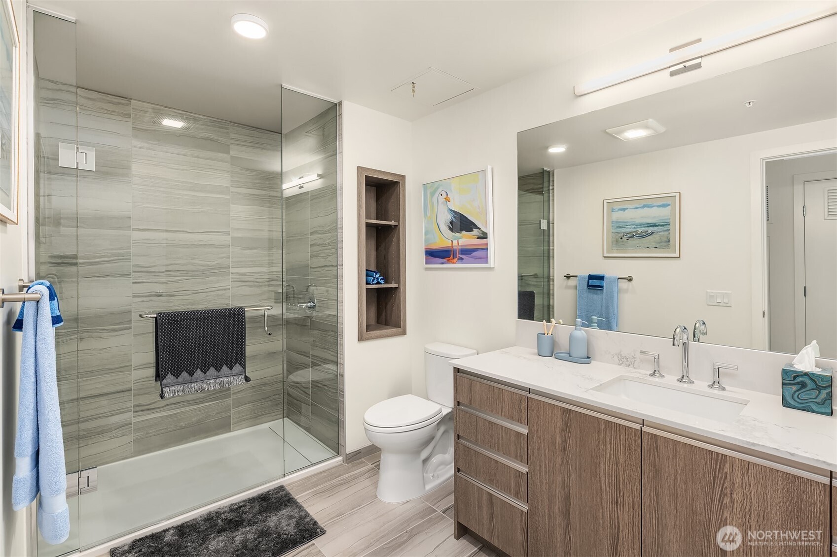 800 Columbia Street, Unit 2307 Seattle, WA 98104 - Photo 10 of 40 a spacious bathroom with a sink a toilet and shower