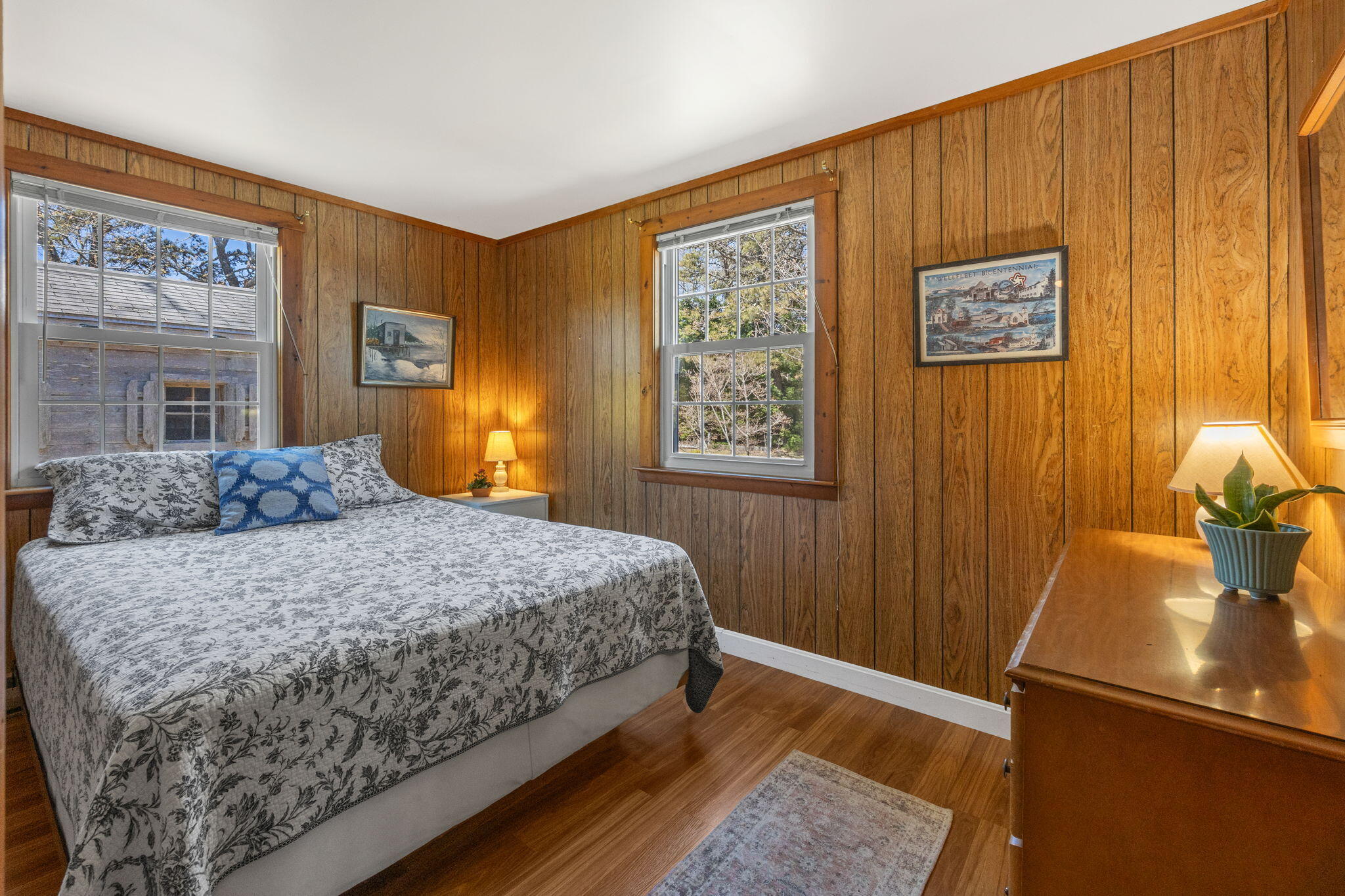 60 Long Avenue, Unit A Wellfleet, MA 02667 - Photo 16 of 28 a bedroom with a bed and wooden floor
