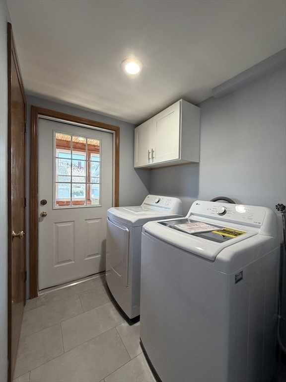 117 Merrymount Road, Unit 1 Quincy, MA 02169 - Photo 2 of 12 a utility room with dryer and washer