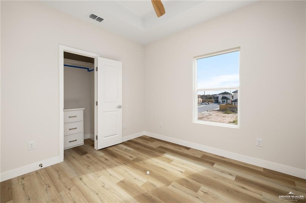 2507 Regina Street Mission, TX 78574 - Photo 11 of 16 an empty room with a empty space and windows