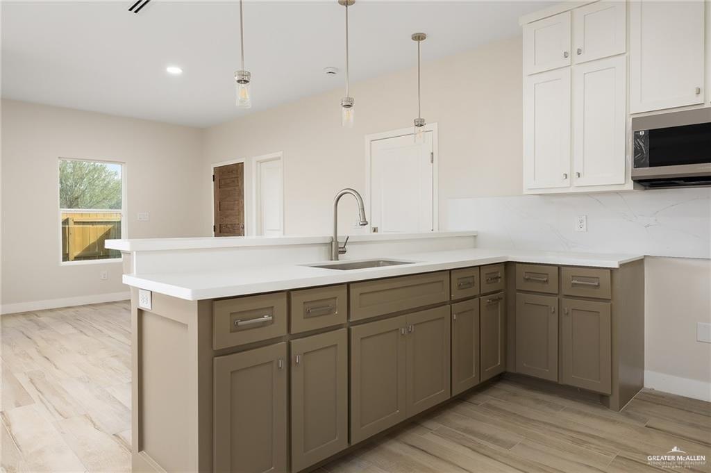 2507 Regina Street Mission, TX 78574 - Photo 6 of 16 a kitchen with sink and cabinets