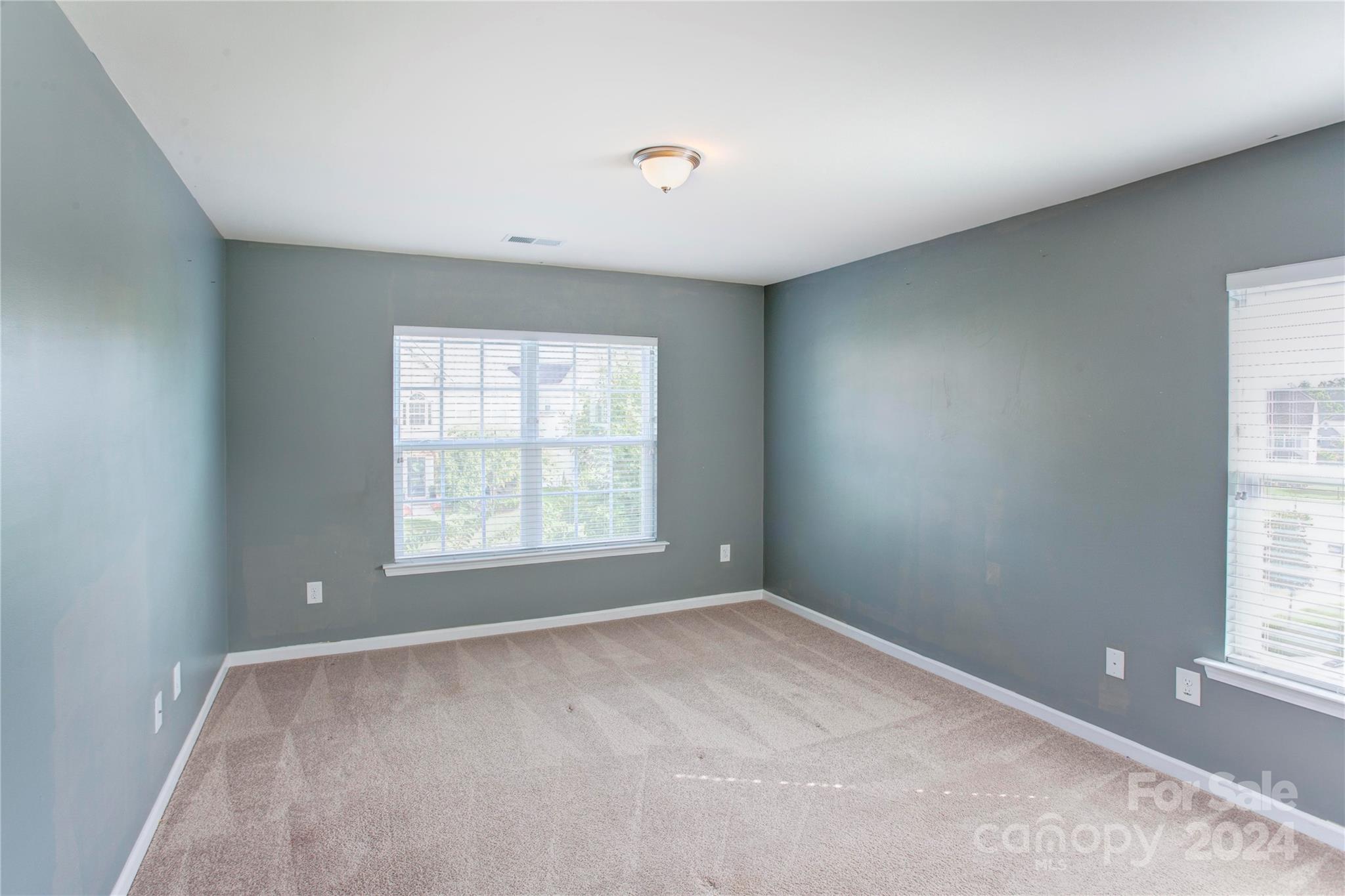 8899 Happiness Road Harrisburg, NC 28075 - Photo 19 of 30 a view of an empty room with a window