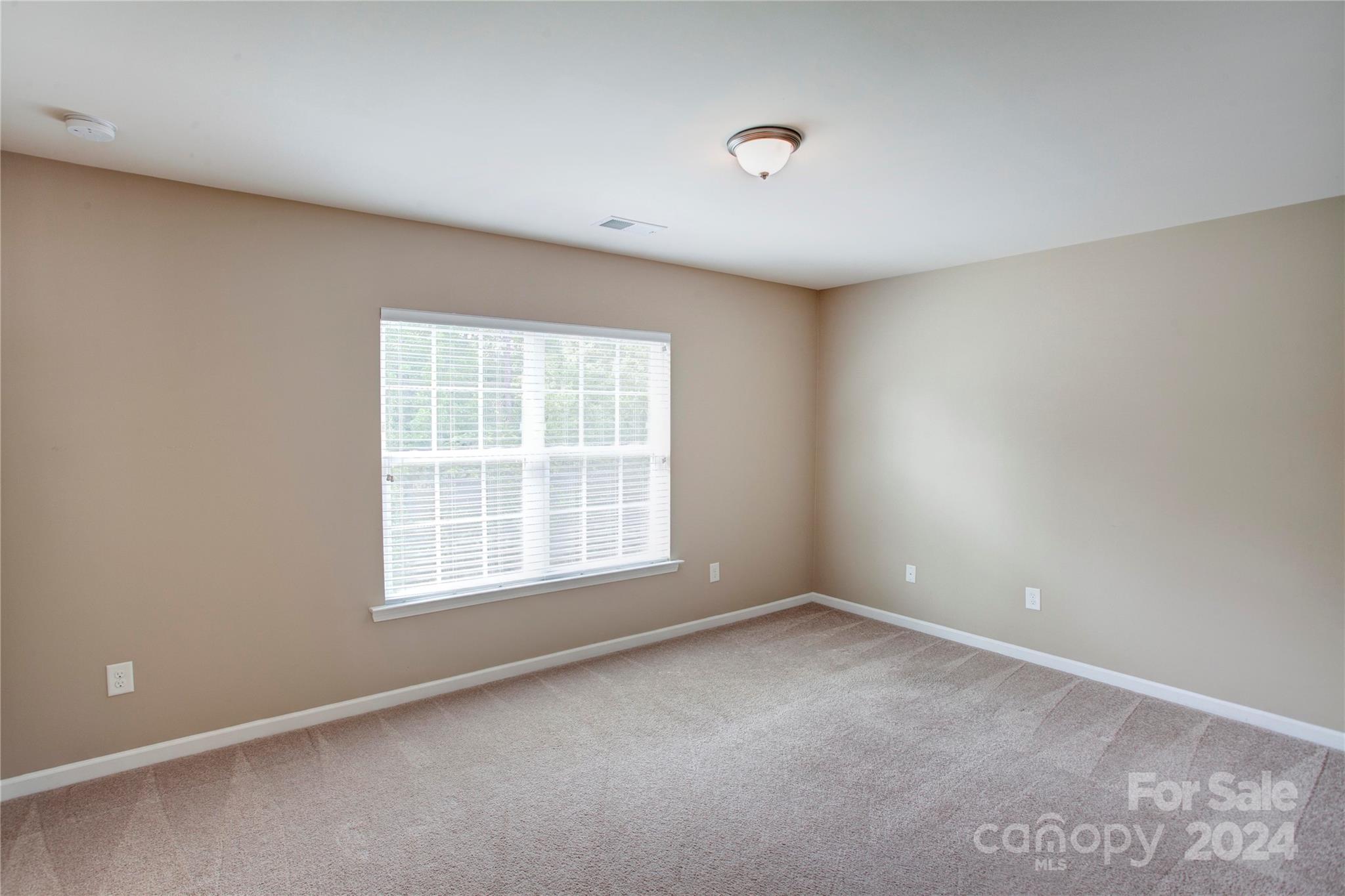 8899 Happiness Road Harrisburg, NC 28075 - Photo 20 of 30 an empty room with a window