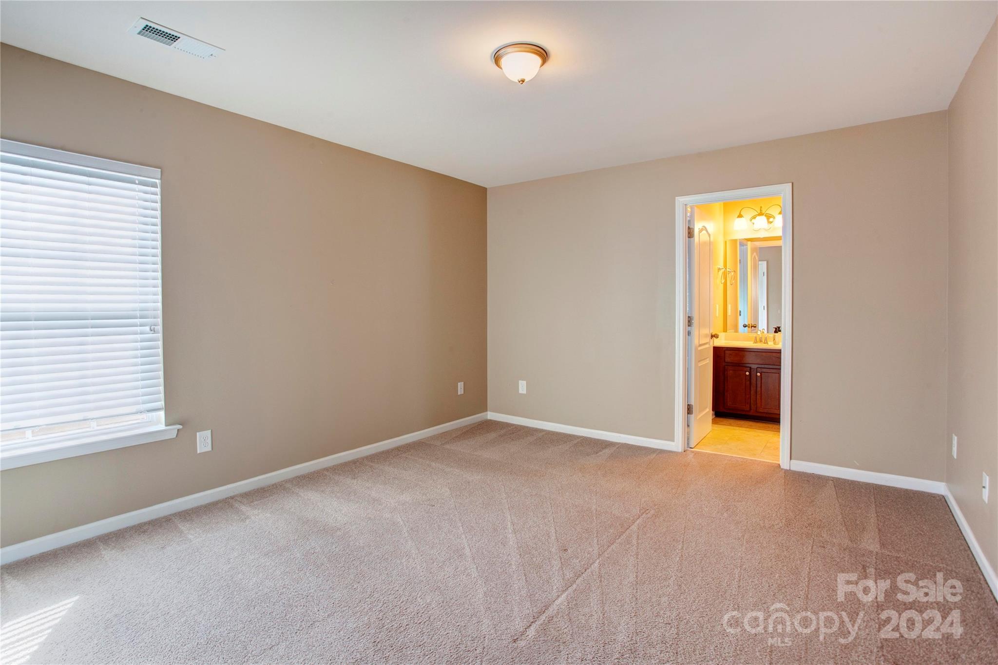 8899 Happiness Road Harrisburg, NC 28075 - Photo 22 of 30 a view of an empty room with a window