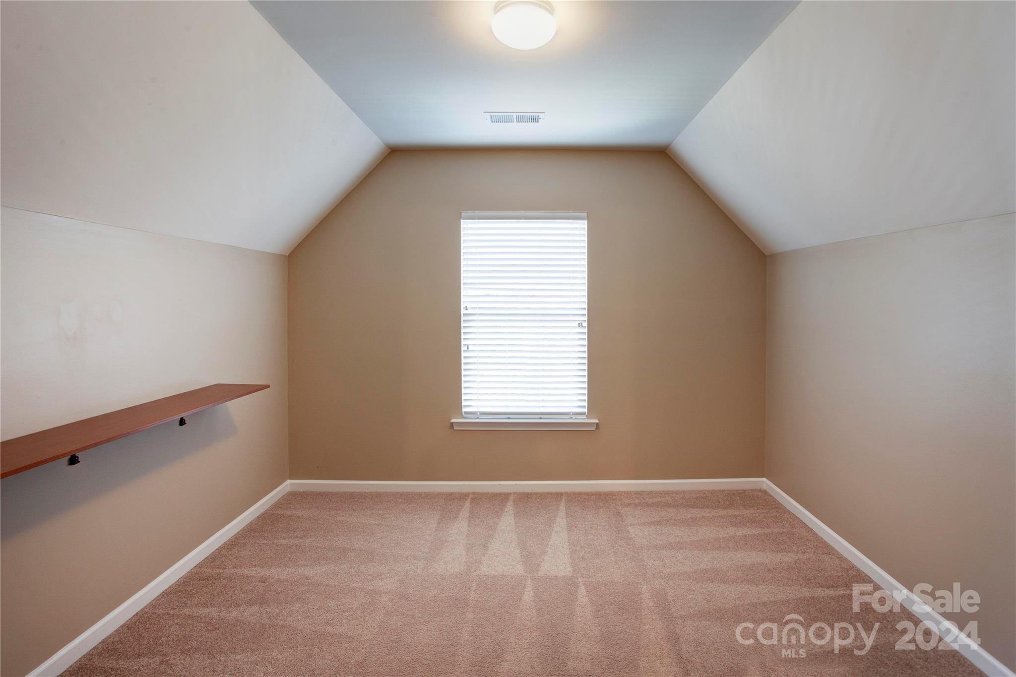 8899 Happiness Road Harrisburg, NC 28075 - Photo 25 of 30 an empty room with a window