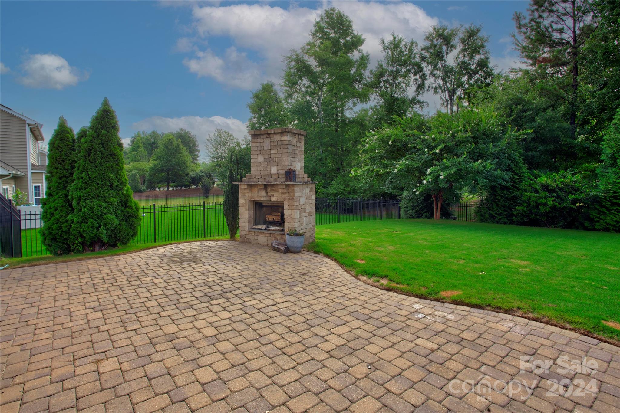 8899 Happiness Road Harrisburg, NC 28075 - Photo 27 of 30 a pathway of a house with a yard