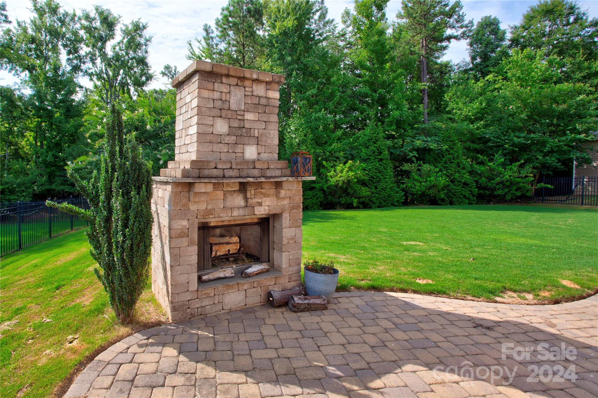 8899 Happiness Road Harrisburg, NC 28075 - Photo 30 of 30 a backyard of a house with seating space