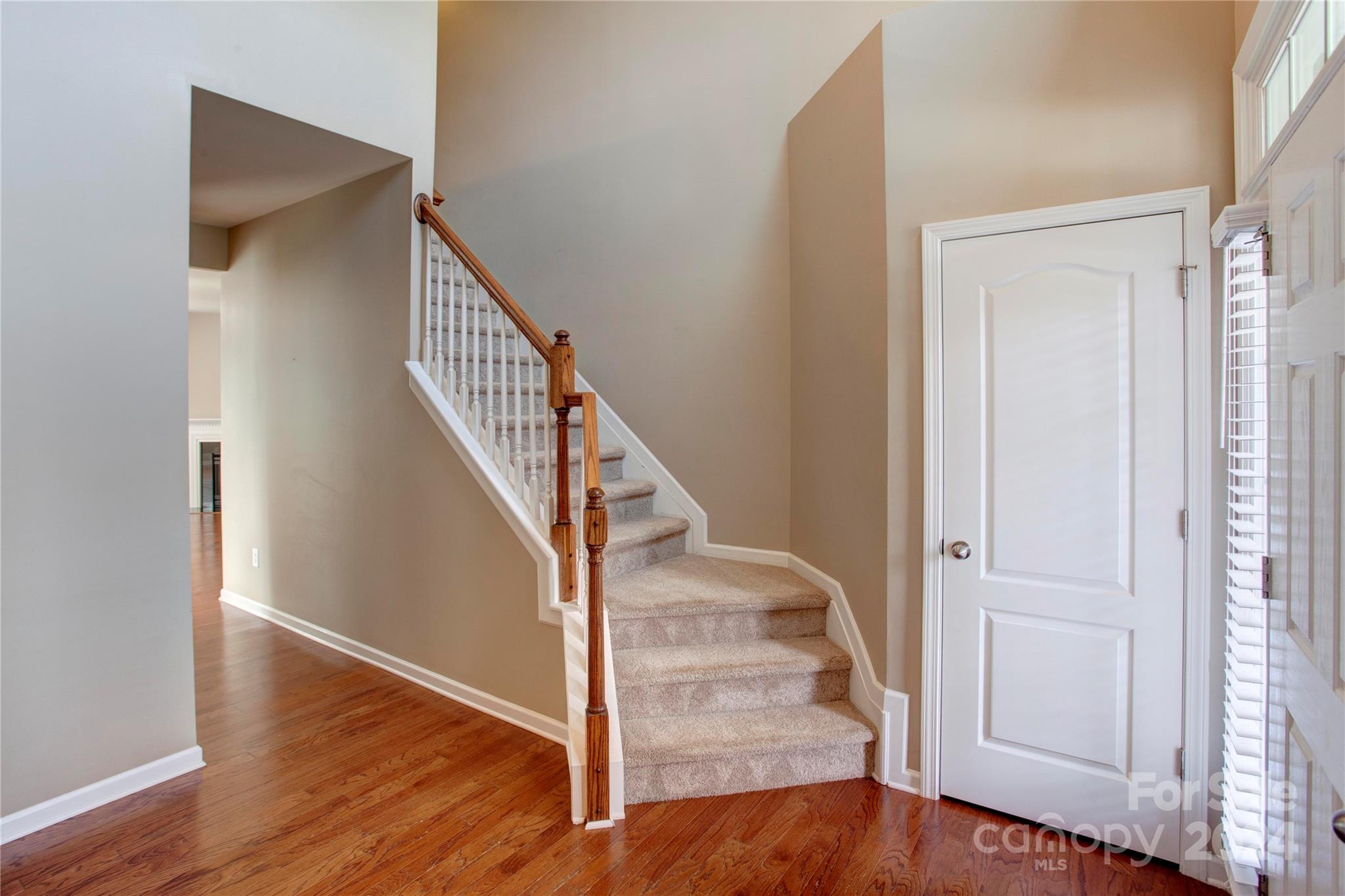 8899 Happiness Road Harrisburg, NC 28075 - Photo 3 of 30 a view of entryway with wooden floor