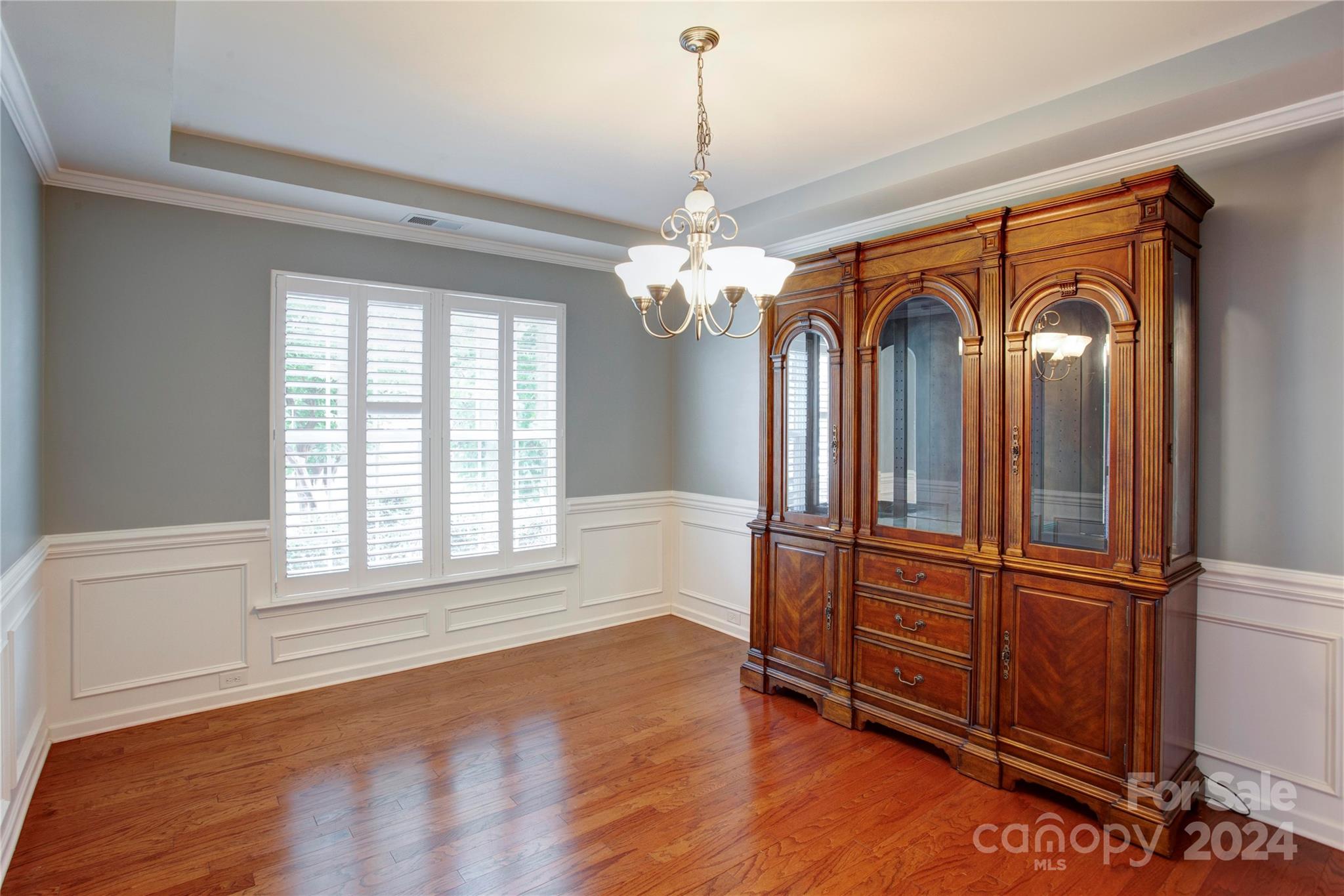 8899 Happiness Road Harrisburg, NC 28075 - Photo 4 of 30 a view of a livingroom with wooden floor and a window