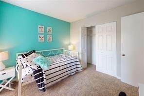 1826 Esters Road, Unit 3024 Irving, TX 75061 - Photo 13 of 30 a bedroom with a bed and a furniture