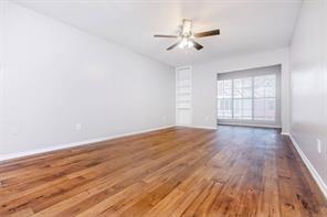 1826 Esters Road, Unit 3024 Irving, TX 75061 - Photo 15 of 30 wooden floor in an empty room with a window