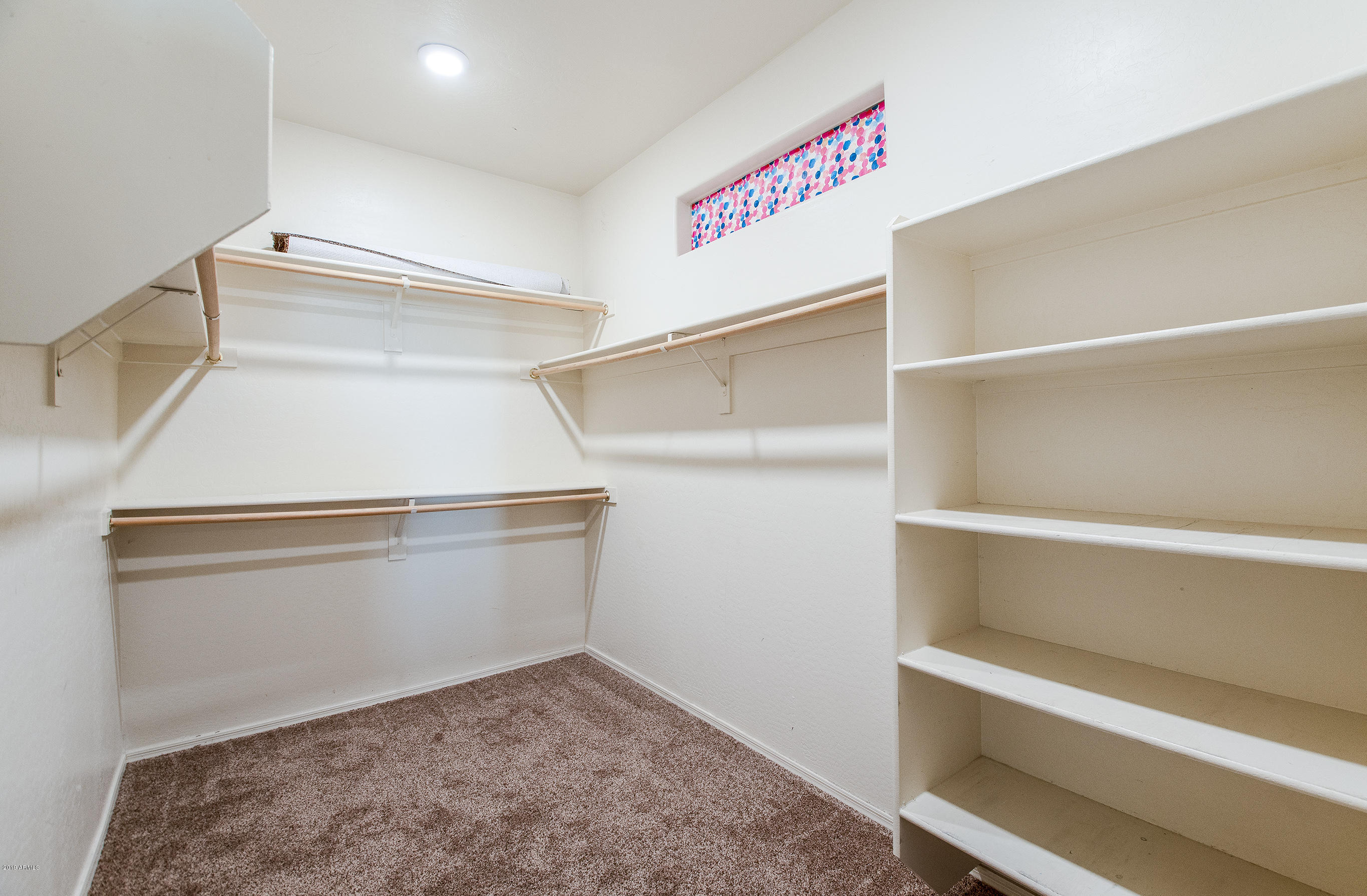 3236 East Phelps Street Gilbert, AZ 85295 - Photo 17 of 29 a view of an empty walk in closet