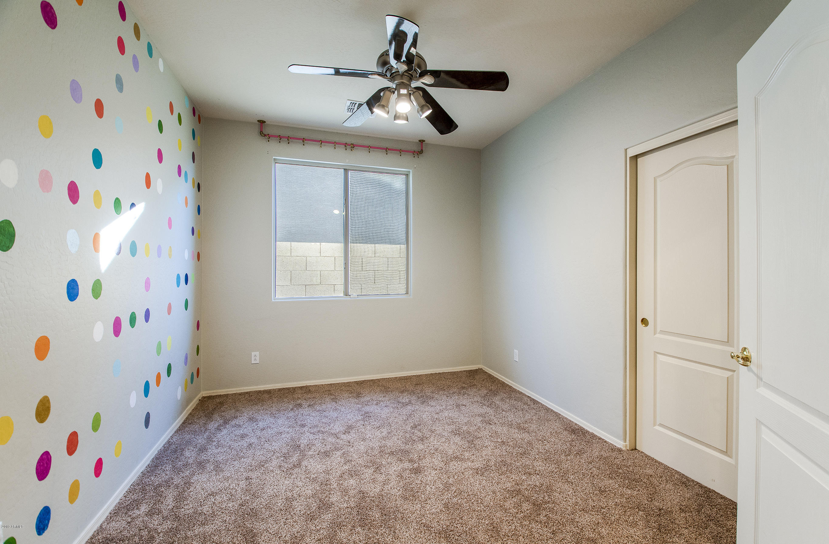 3236 East Phelps Street Gilbert, AZ 85295 - Photo 20 of 29 a bathroom with a window and a mirror