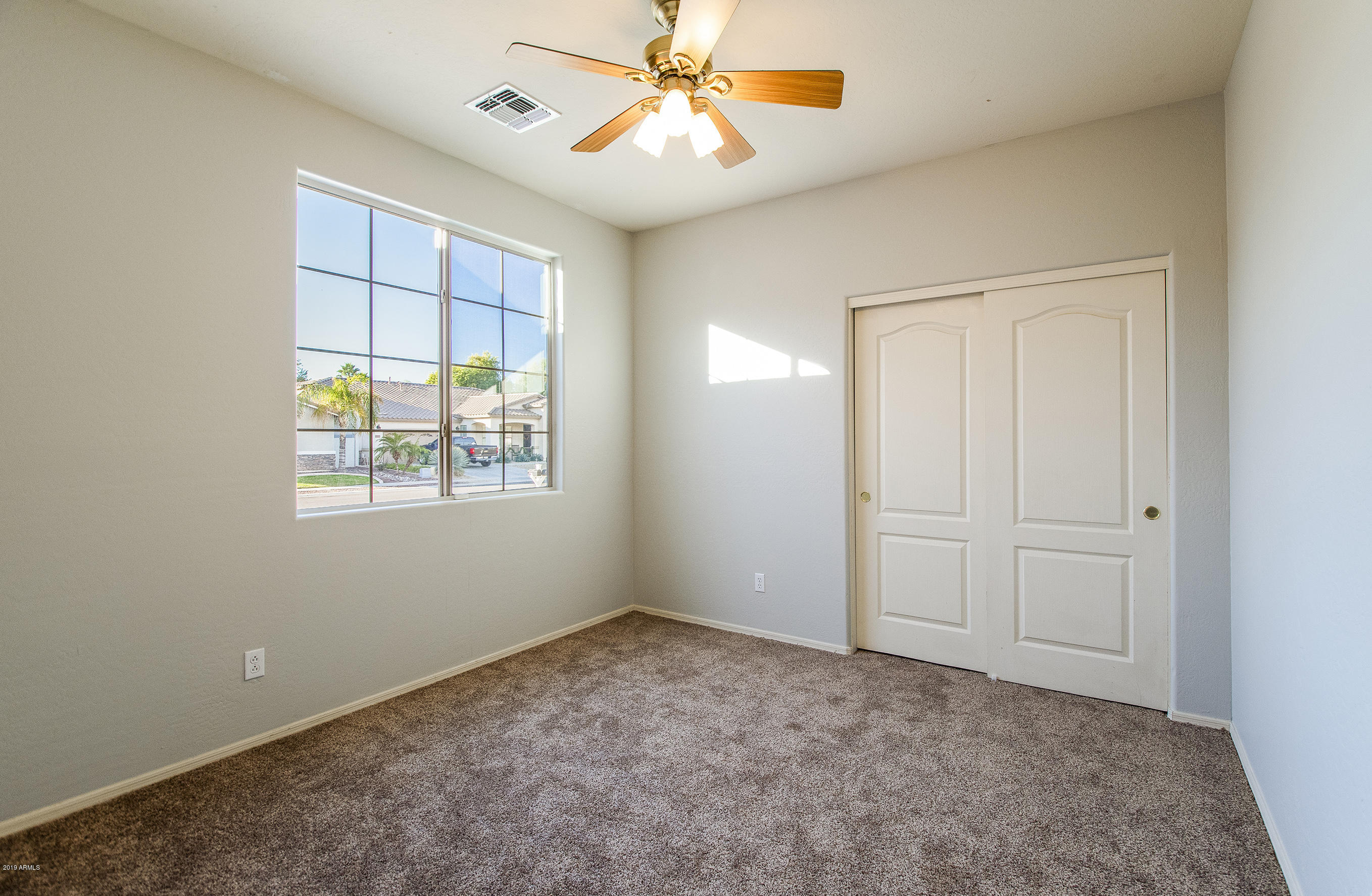3236 East Phelps Street Gilbert, AZ 85295 - Photo 22 of 29 a view of an empty room with a window