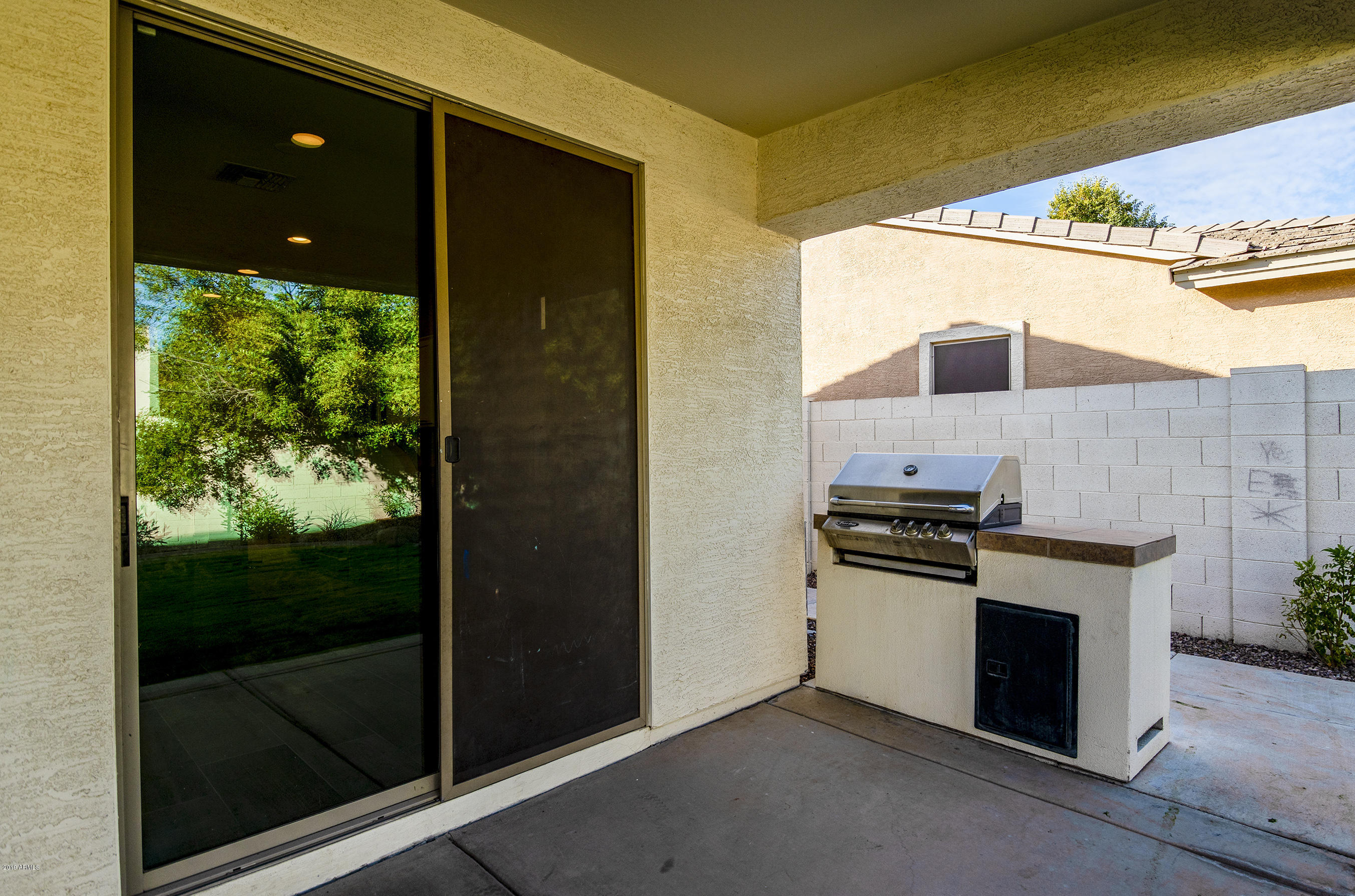 3236 East Phelps Street Gilbert, AZ 85295 - Photo 27 of 29 a kitchen that has a stove and a microwave