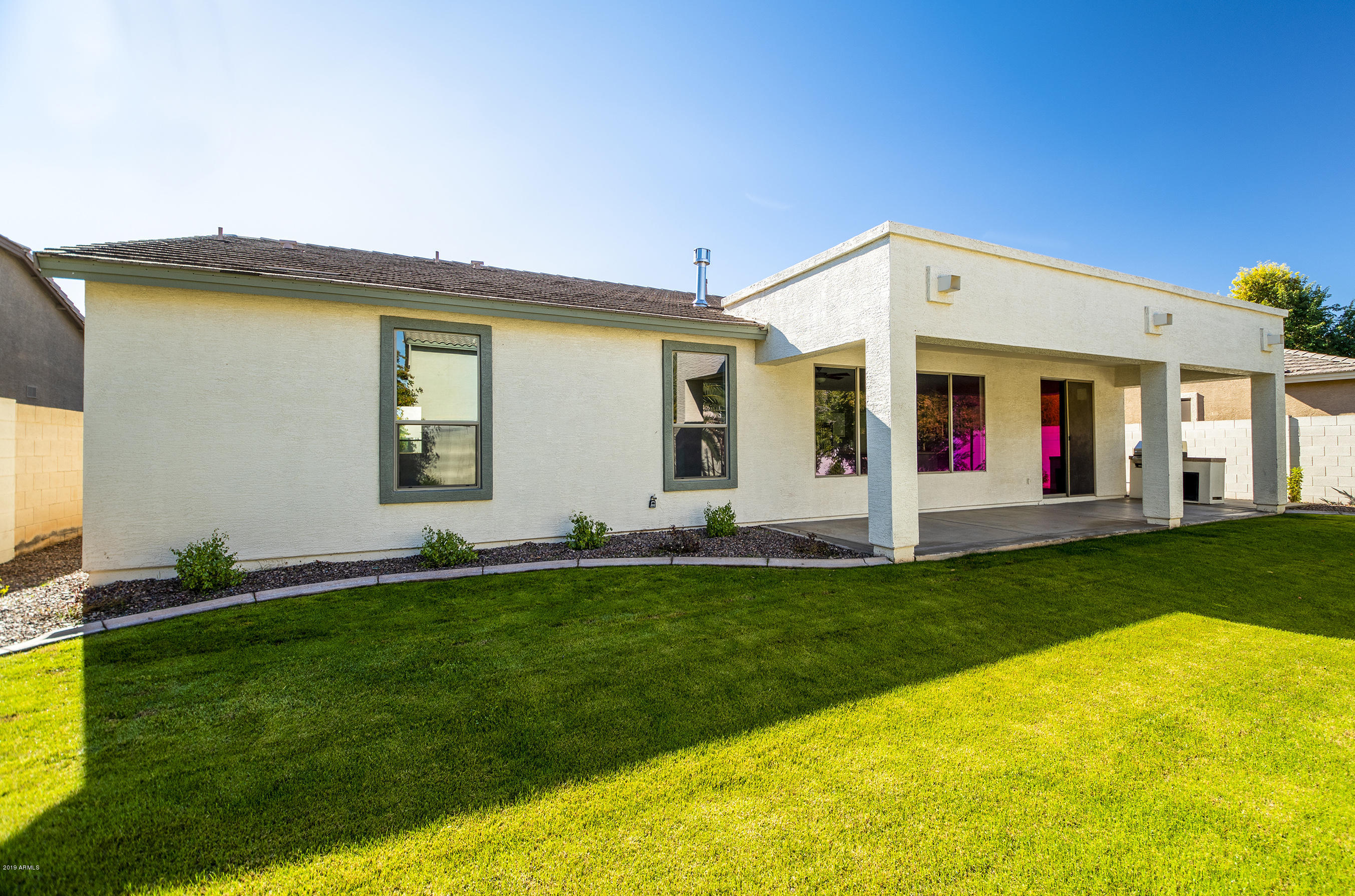 3236 East Phelps Street Gilbert, AZ 85295 - Photo 29 of 29 a view of an house with backyard space and garden