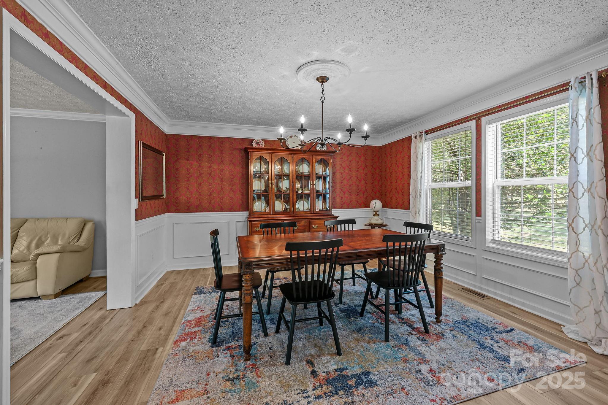25611 Bridgeport Road Albemarle, NC 28001 - Photo 11 of 47 a view of a dining room with furniture window and wooden floor