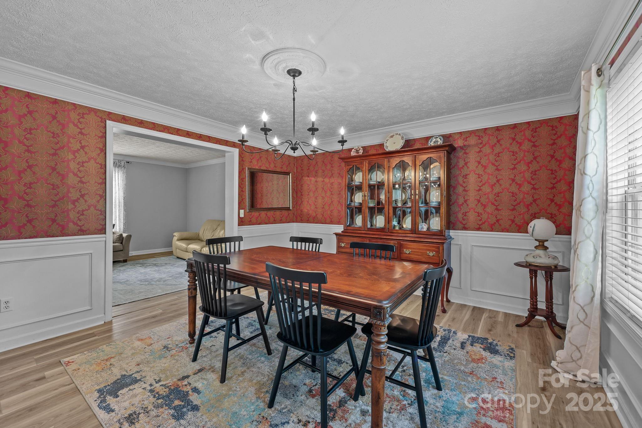25611 Bridgeport Road Albemarle, NC 28001 - Photo 12 of 47 a view of a dining room with furniture and chandelier