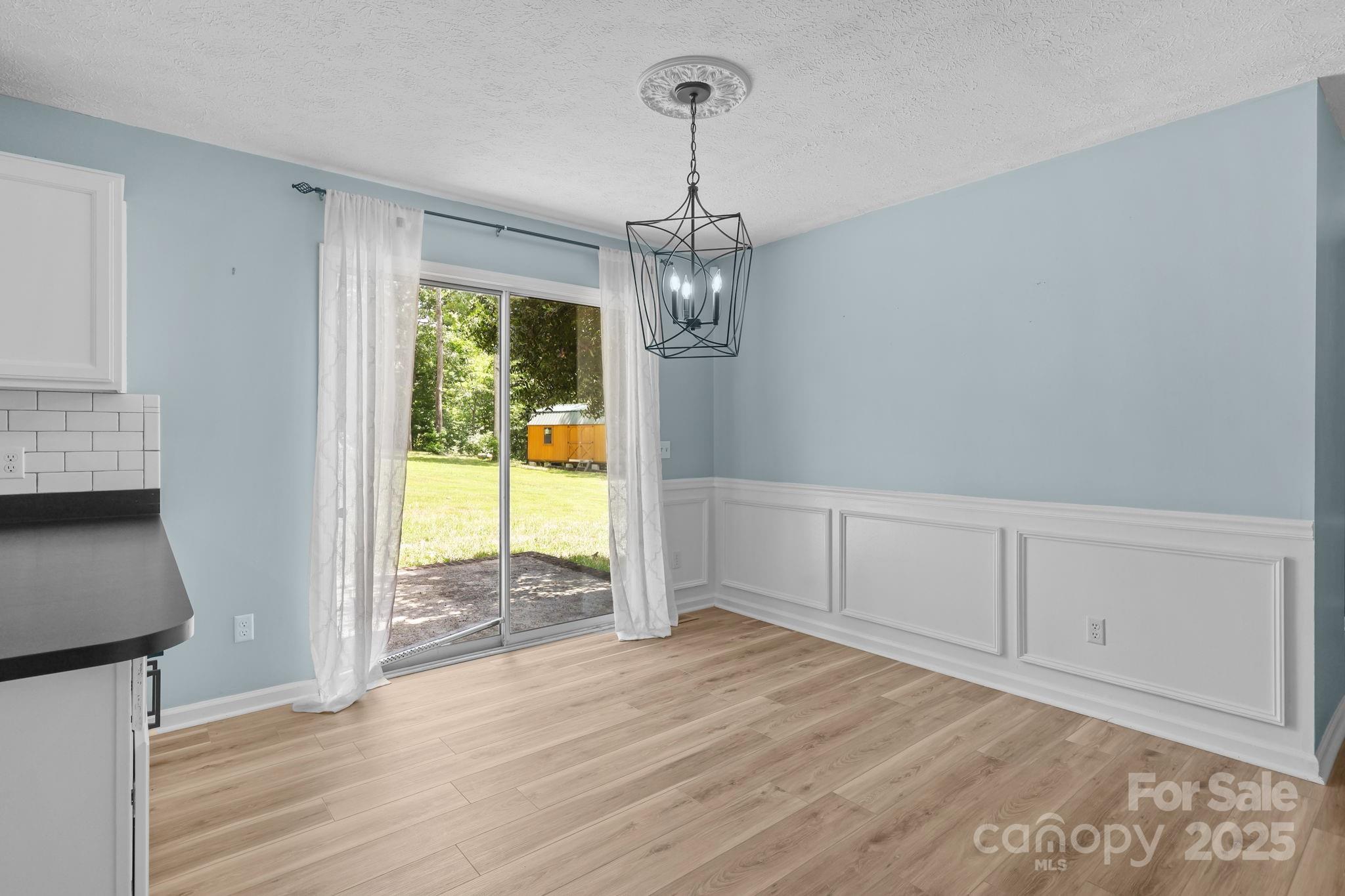 25611 Bridgeport Road Albemarle, NC 28001 - Photo 16 of 47 a view of a room with wooden floor and walls