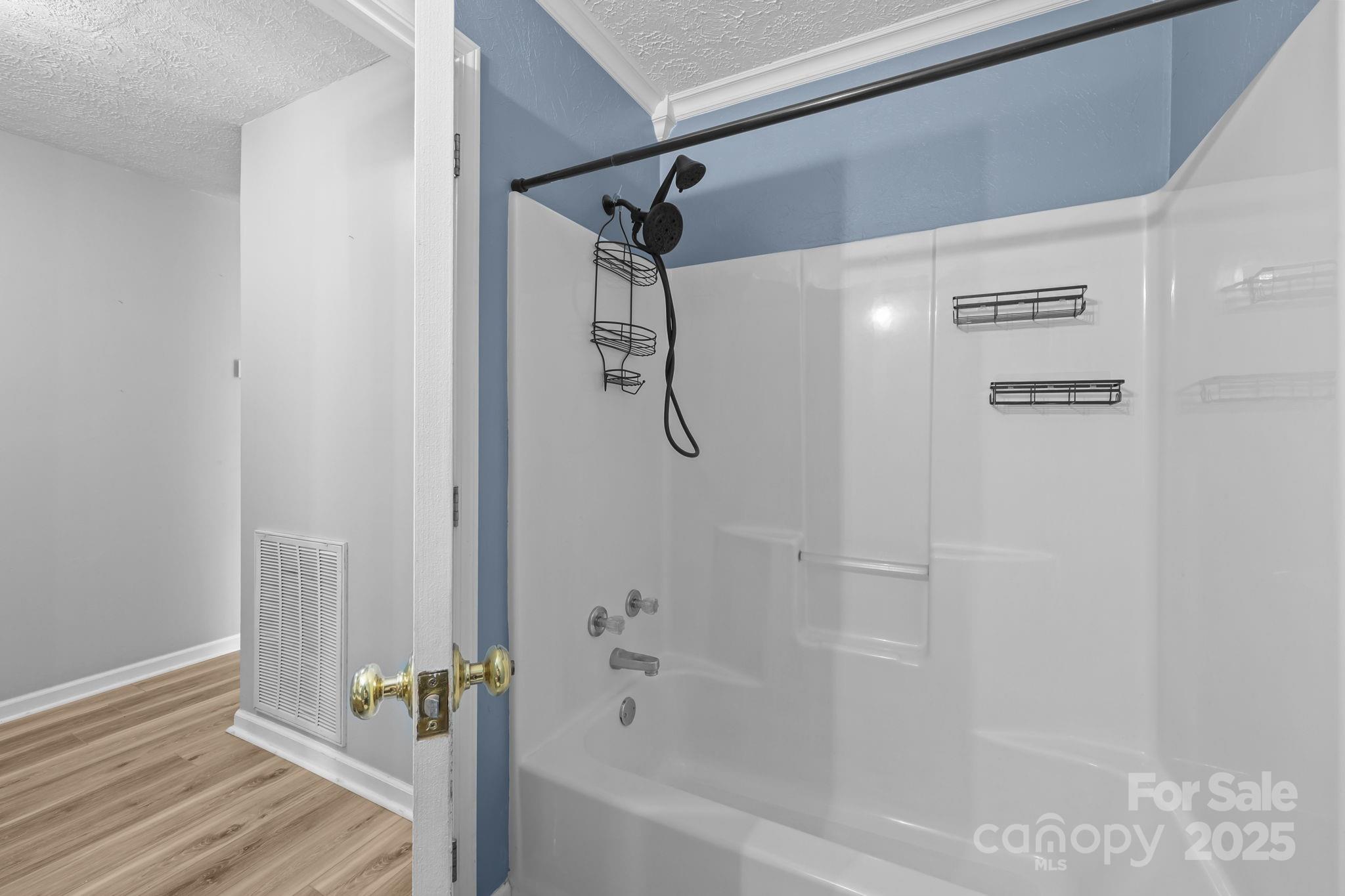 25611 Bridgeport Road Albemarle, NC 28001 - Photo 21 of 47 a bathroom with a glass shower door