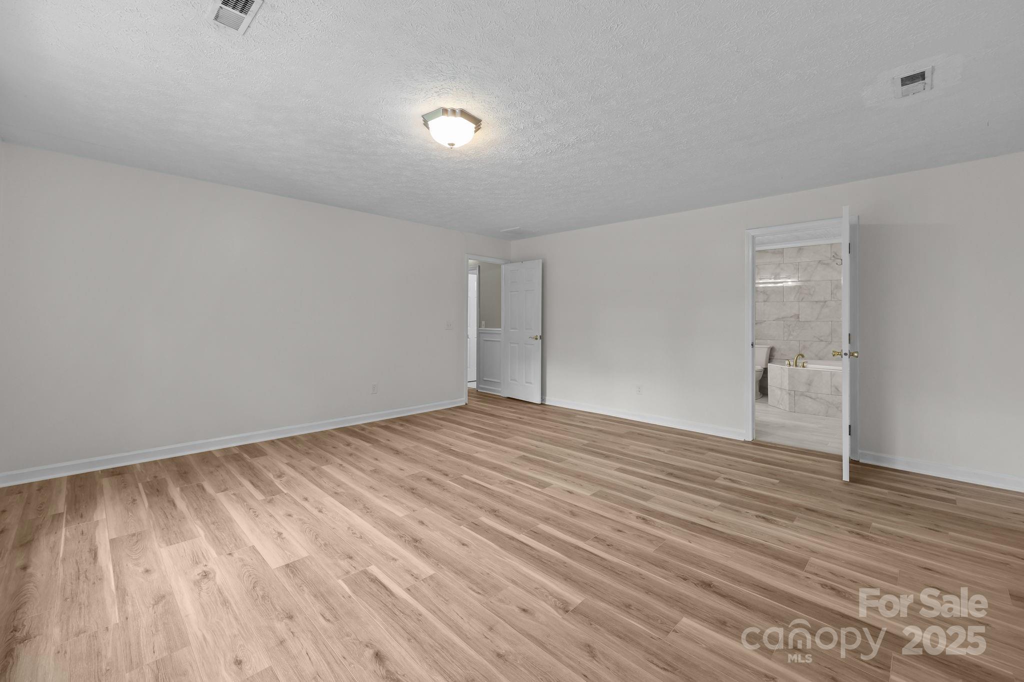 25611 Bridgeport Road Albemarle, NC 28001 - Photo 25 of 47 a view of empty room with wooden floor