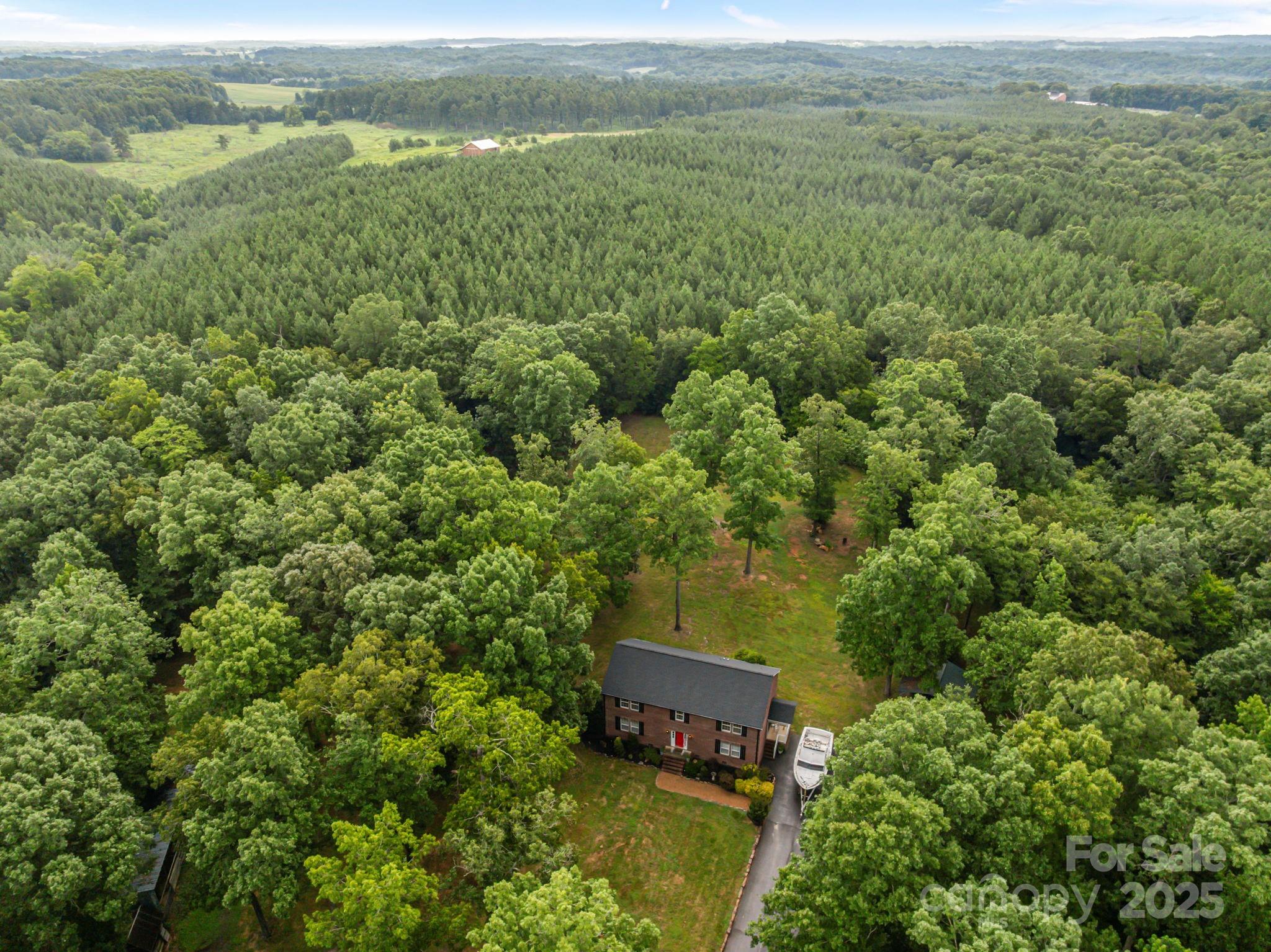 25611 Bridgeport Road Albemarle, NC 28001 - Photo 44 of 47 a view of a field with an outdoor space and seating