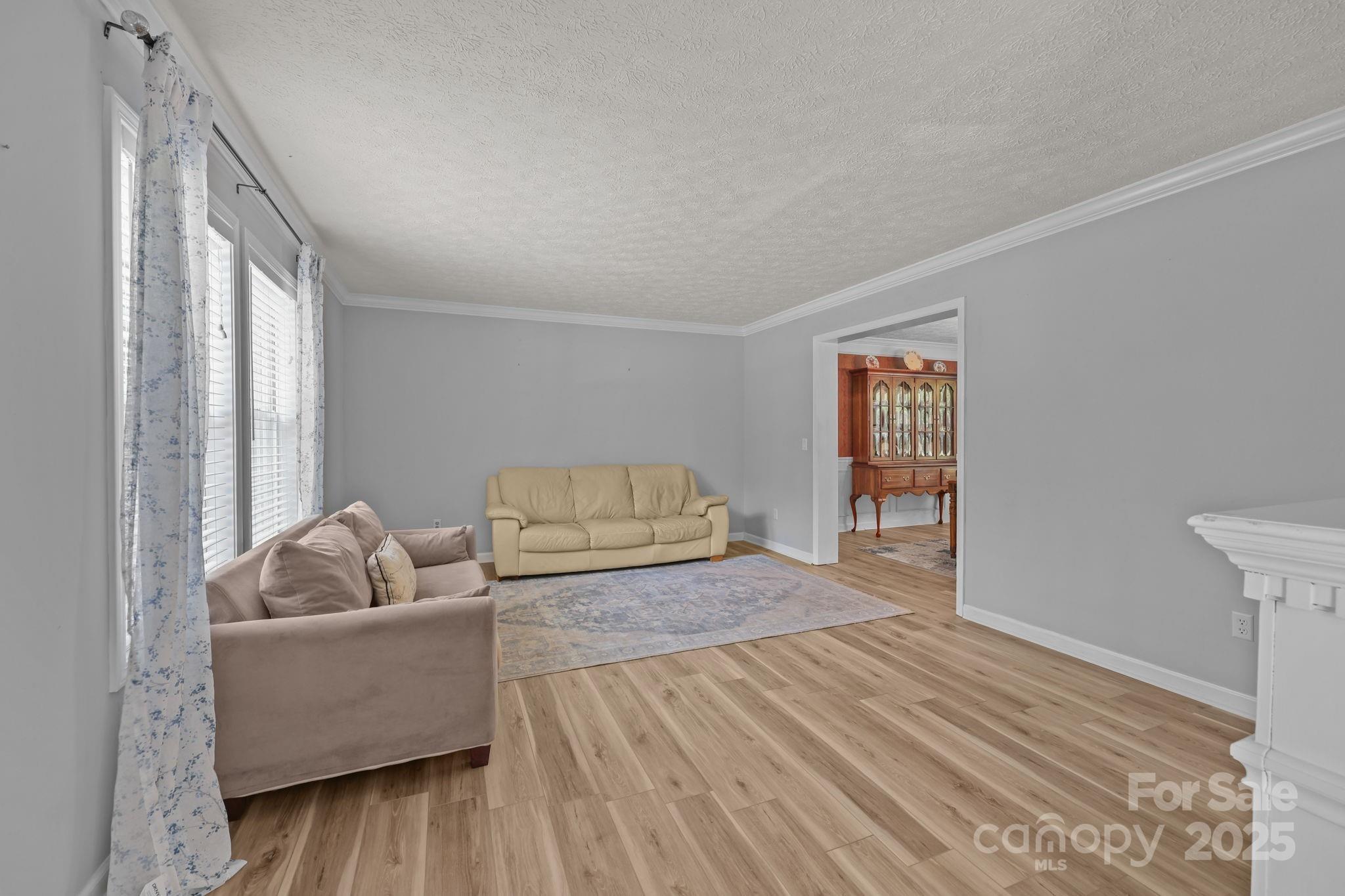 25611 Bridgeport Road Albemarle, NC 28001 - Photo 9 of 47 a living room with furniture and a window