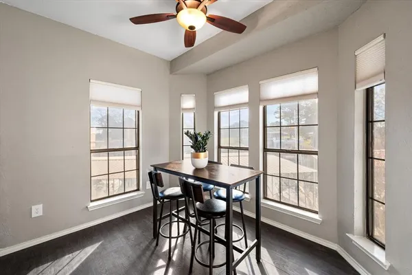 a dining room with furniture and window