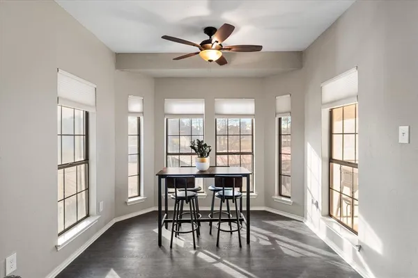 a dining room with furniture and window