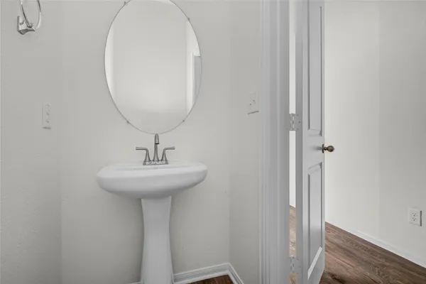 a bathroom with a sink and mirror