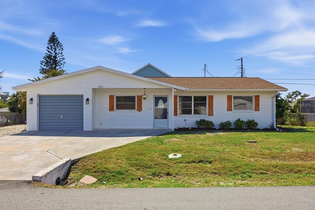 4872 Nautilus Road Venice, FL 34293 - Photo 1 of 1 a front view of a house with garden