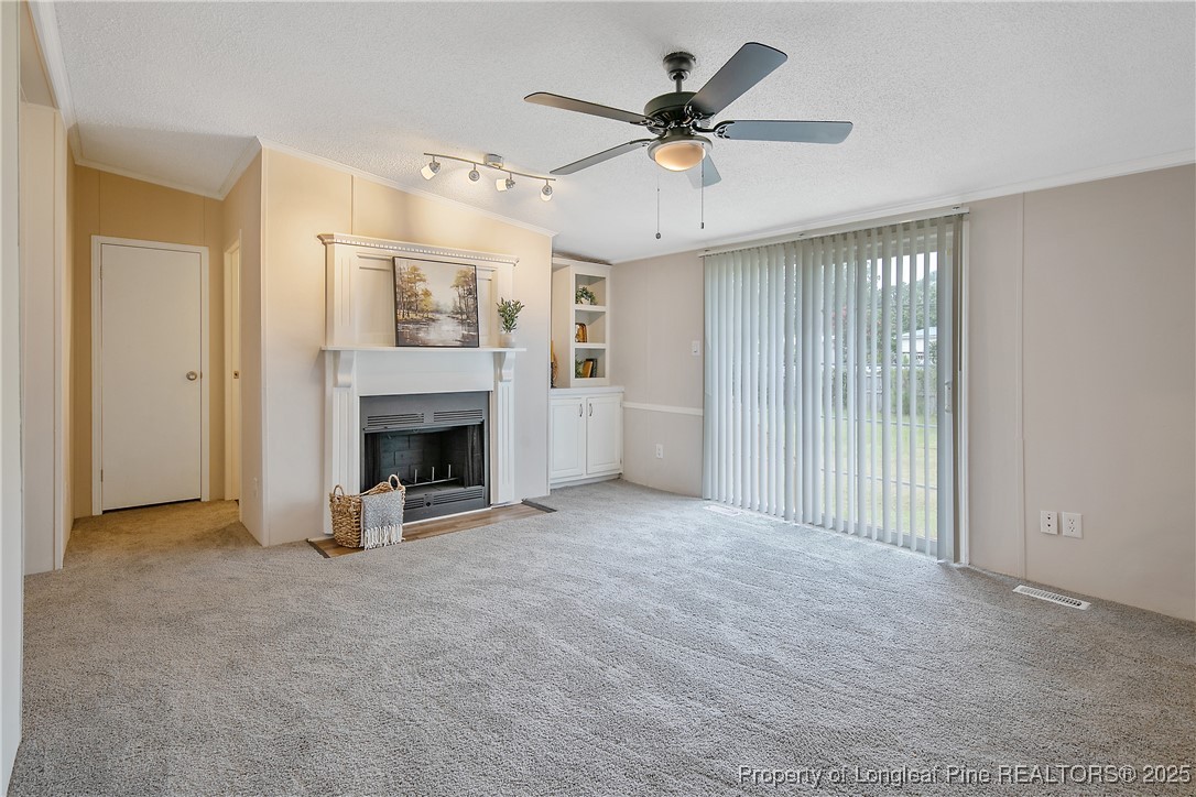 43 Columbus Court Spring Lake, NC 28390 - Photo 13 of 22 an empty room with windows and fireplace