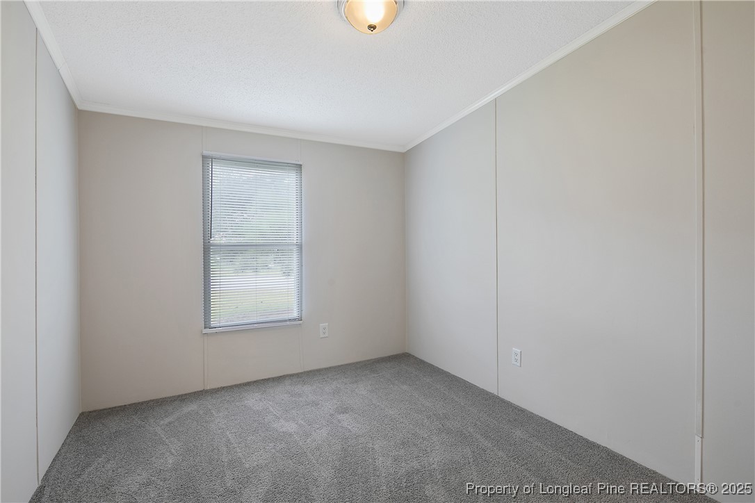 43 Columbus Court Spring Lake, NC 28390 - Photo 15 of 22 an empty room with windows and closet