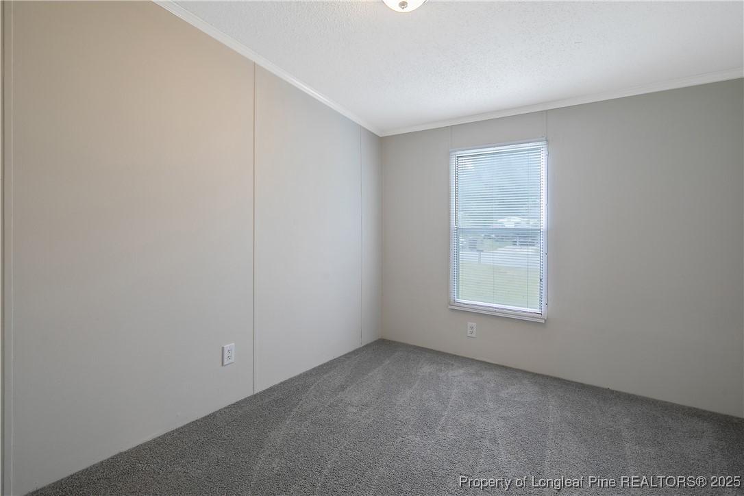 43 Columbus Court Spring Lake, NC 28390 - Photo 18 of 22 an empty room with a window
